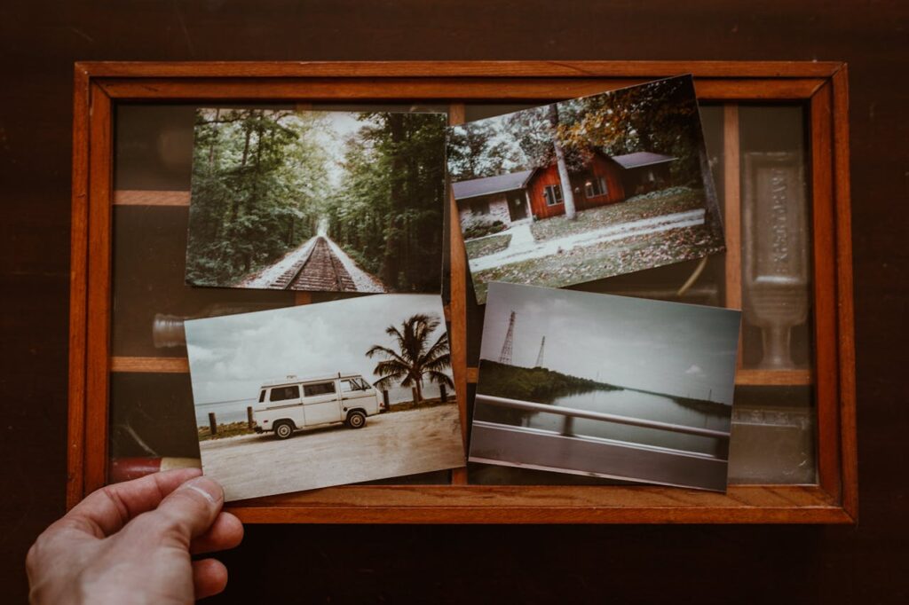 Photo of Person Showing Old Photos