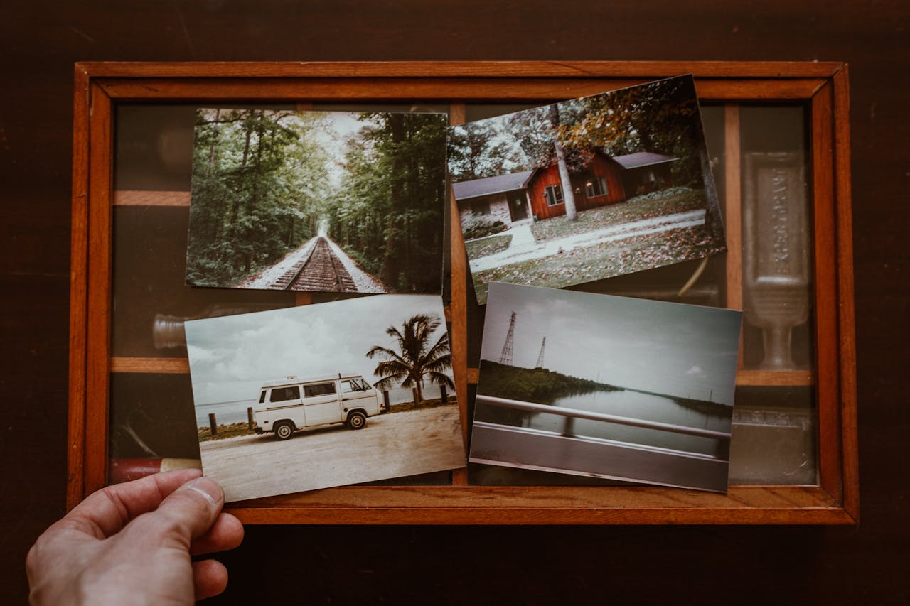 Photo of Person Showing Old Photos