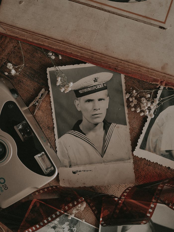 Man in White Collared Shirt Holding Camera